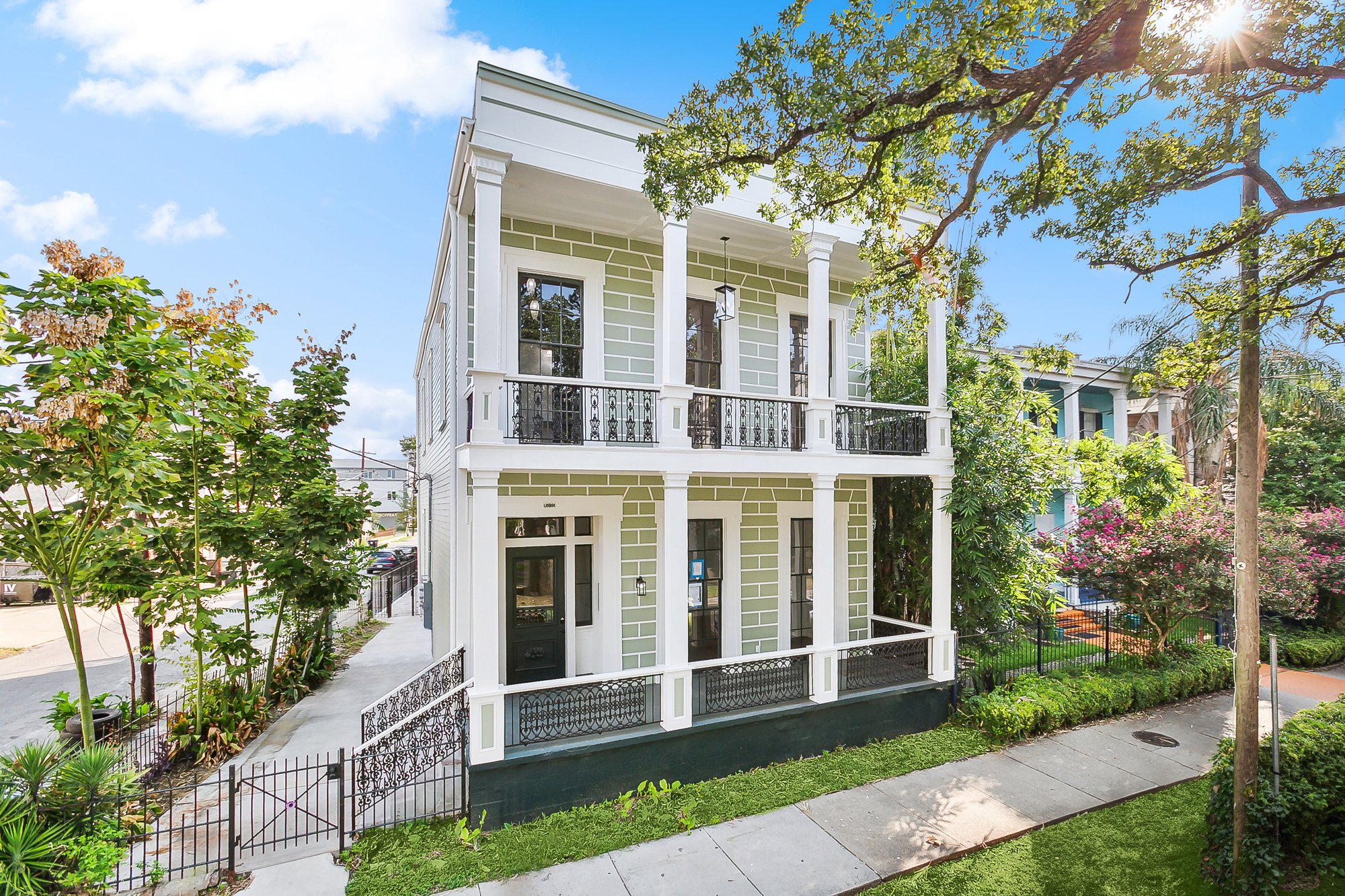 1265 Esplanade &mdash; restored double-gallery facade with cast-iron railings